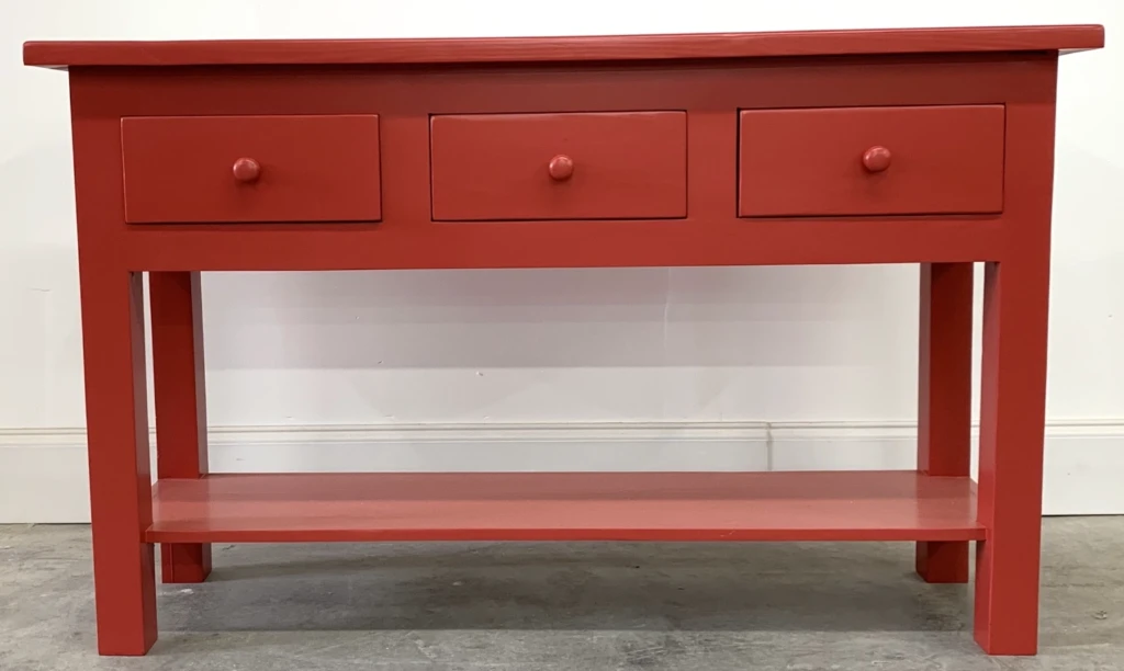 Solid wood console table finished in bold red painted lacquer, showcasing a modern custom furniture refinishing project in Raleigh NC.