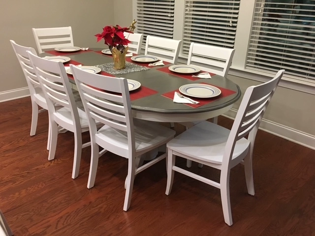 Two-tone refinished oak dining table with painted lacquer pedestal base and matching chairs, completed for a Glenwood Avenue home in Raleigh NC.