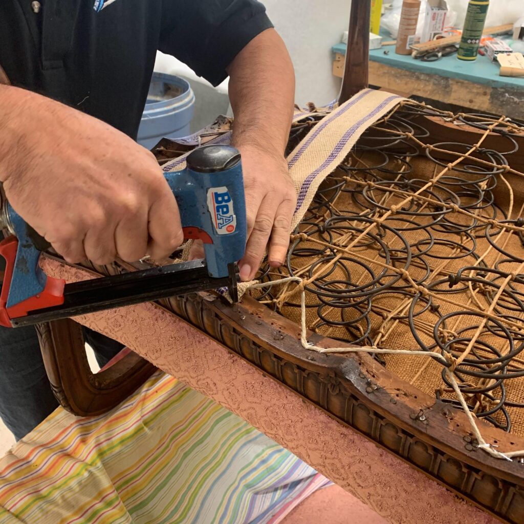 The Art and Craft of Master Upholstery: Finish Pros and Master Craftsmanship in North Carolina 1 Traditional eight-way hand-tied chair spring system during upholstery restoration.