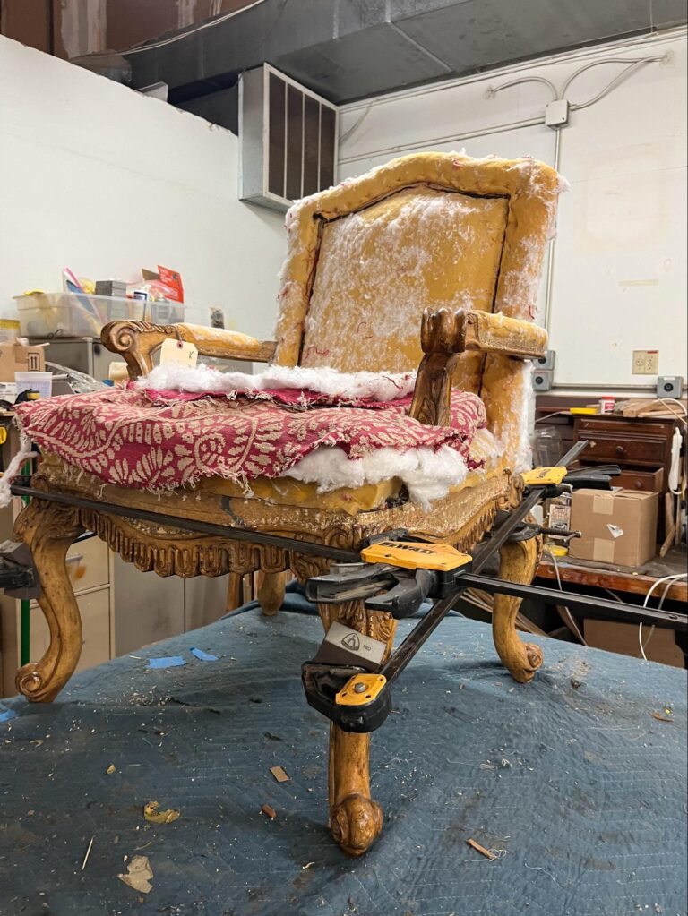 The Art and Craft of Master Upholstery: Finish Pros and Master Craftsmanship in North Carolina 7 Finish Pros upholsterer rebuilding the internal frame structure of a custom chair.