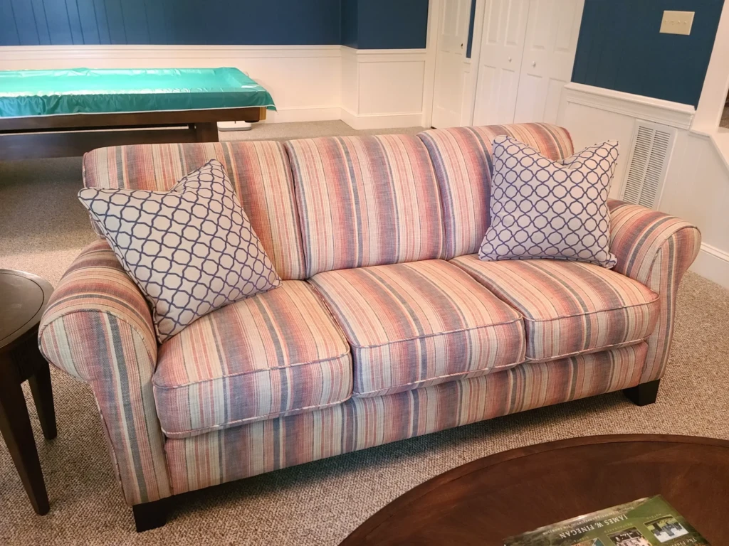 sofa-reupholstered-in-fabricut-wildfire-henna-blue-with-basilica-indigo-pillows. Reupholstery