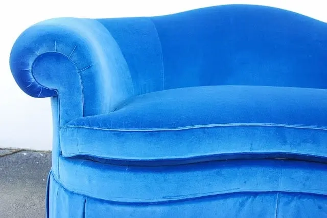 Velvet upholstered sofa with medium-compression foam cushion and plush pillowtop poly Dacron wrap — custom sofa cushion foam replacement by Finish Pros Raleigh NC