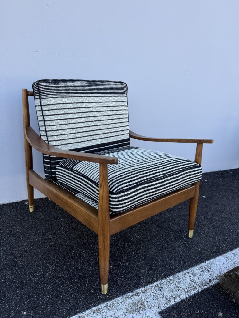Sofa Cushion Foam Replacement Solutions: Restore Comfort & Support with Finish Pros 5 Mid-century modern armchair fully reupholstered in black and white striped fabric, featuring custom cushions and wood frame restoration.