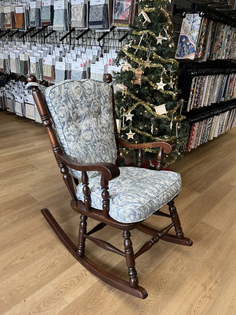 What to look for in quality furniture 2 Restored rocking chair after full refinishing and reupholstery by Finish Pros. The chair was completely stripped and re-stained with a custom wood finish, then reupholstered in Barrow’s Birmingham 11914 fabric for a refreshed yet timeless look.