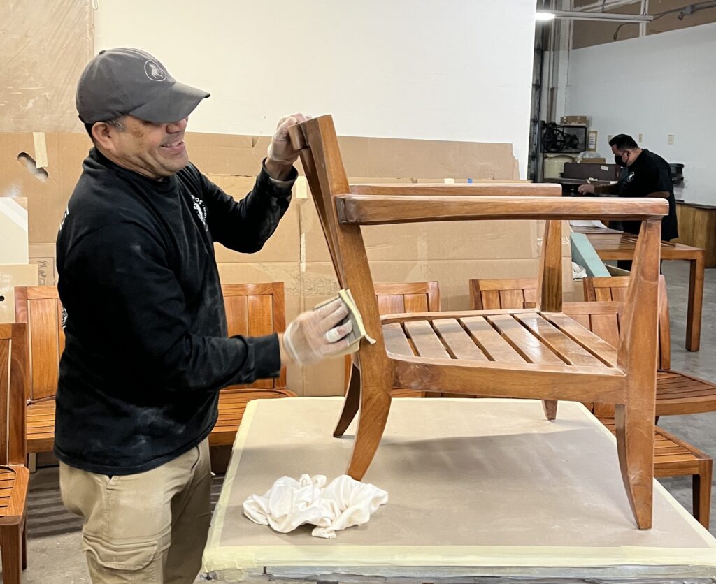 What to look for in quality furniture 6 A solid wood chair undergoing refinishing, showing how worn surfaces, scratches, and finish damage can be corrected through professional sanding.
