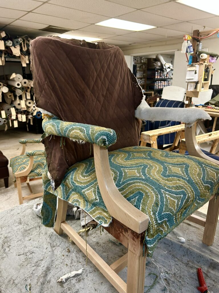 What Happens During a Finish Pros Design Consultation? 4 Replacing old upholstery fabric with new custom fabric during furniture reupholstery by Finish Pros in Raleigh NC
